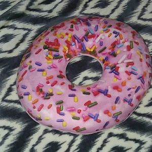 A pink doughnut pillow